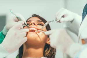 Woman getting her teeth worked on by Knoxville TN dentists