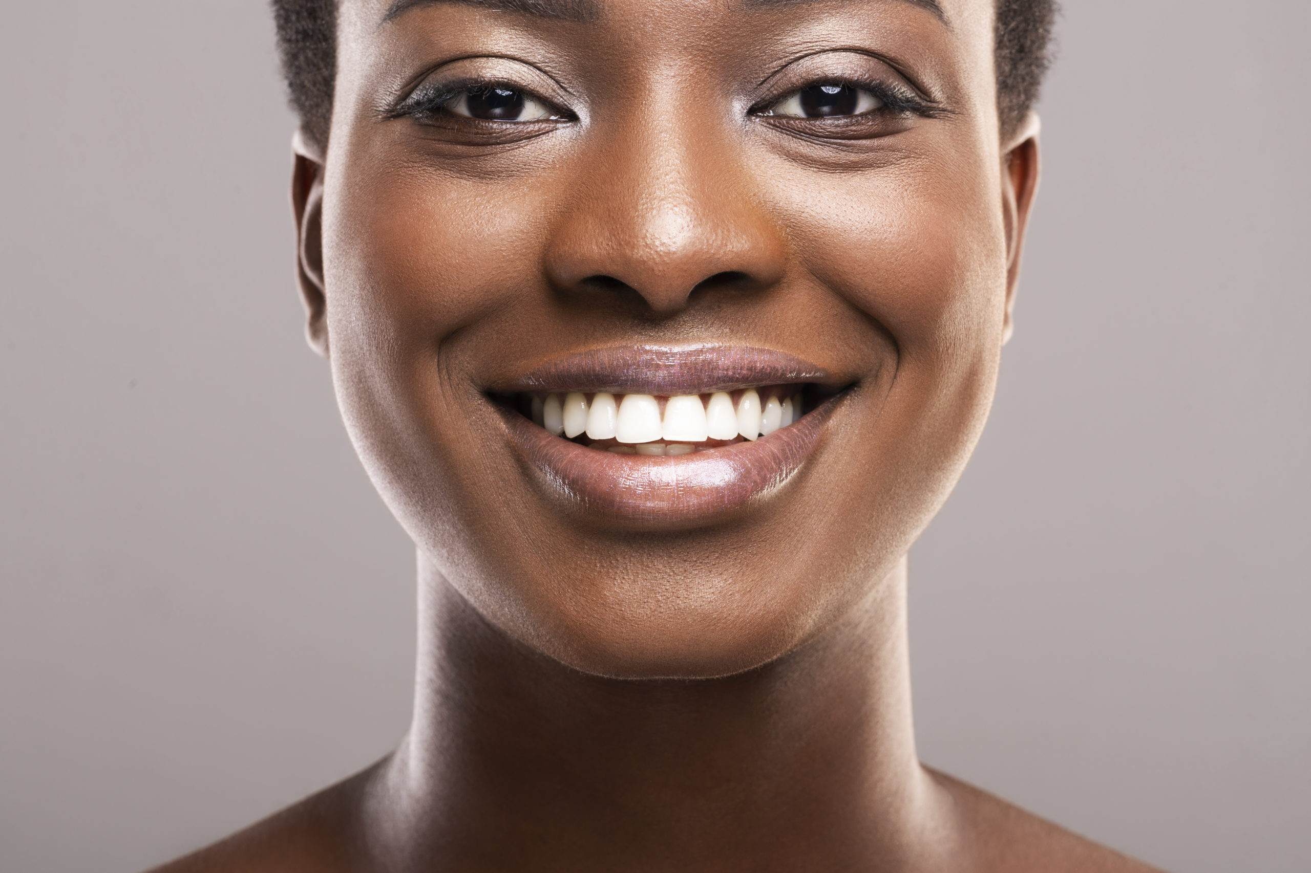Portrait of black woman with perfect skin and white teeth - University  General Dentists