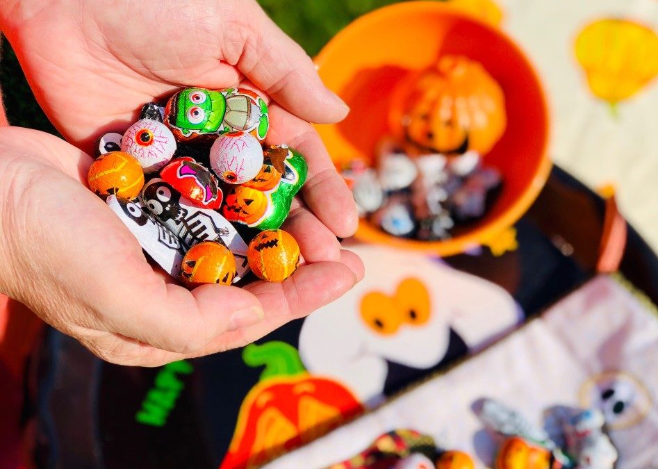 hands holding halloween candy