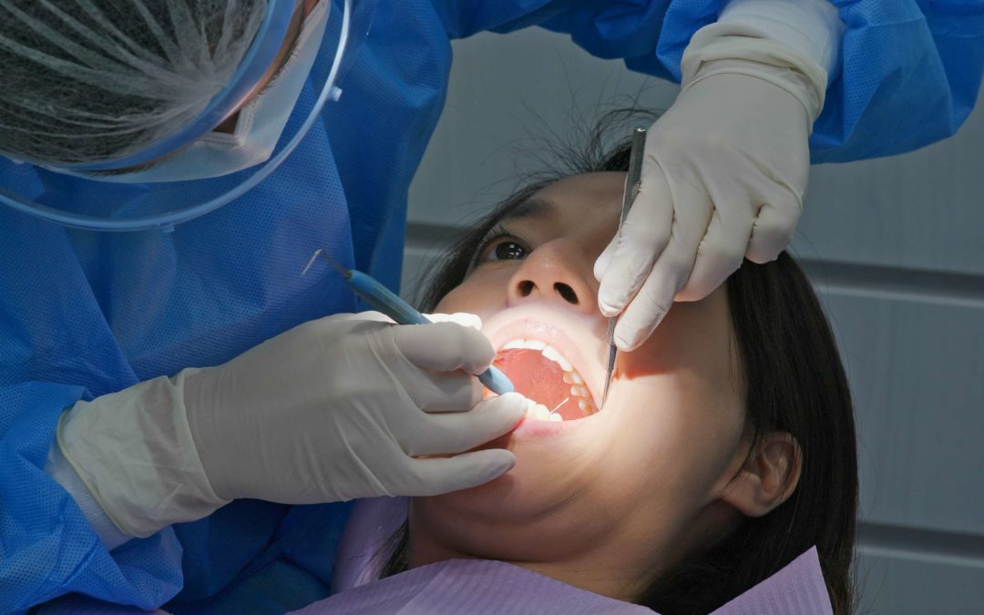 woman getting dental treatment from a knoxville dentist